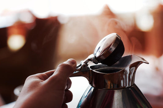 How to clean a kettle by unhinging it firmly.
