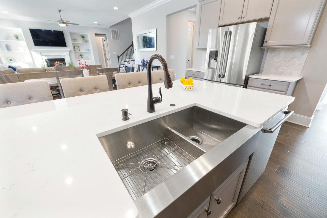 Stainless steel in the kitchen reflecting countertop sheen.